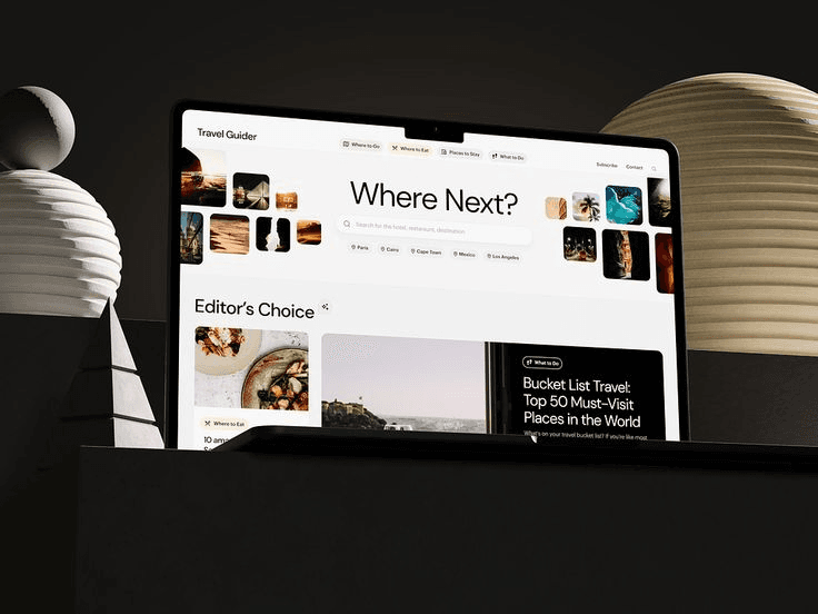 Tablet showing a travel app beside sculptural shapes
